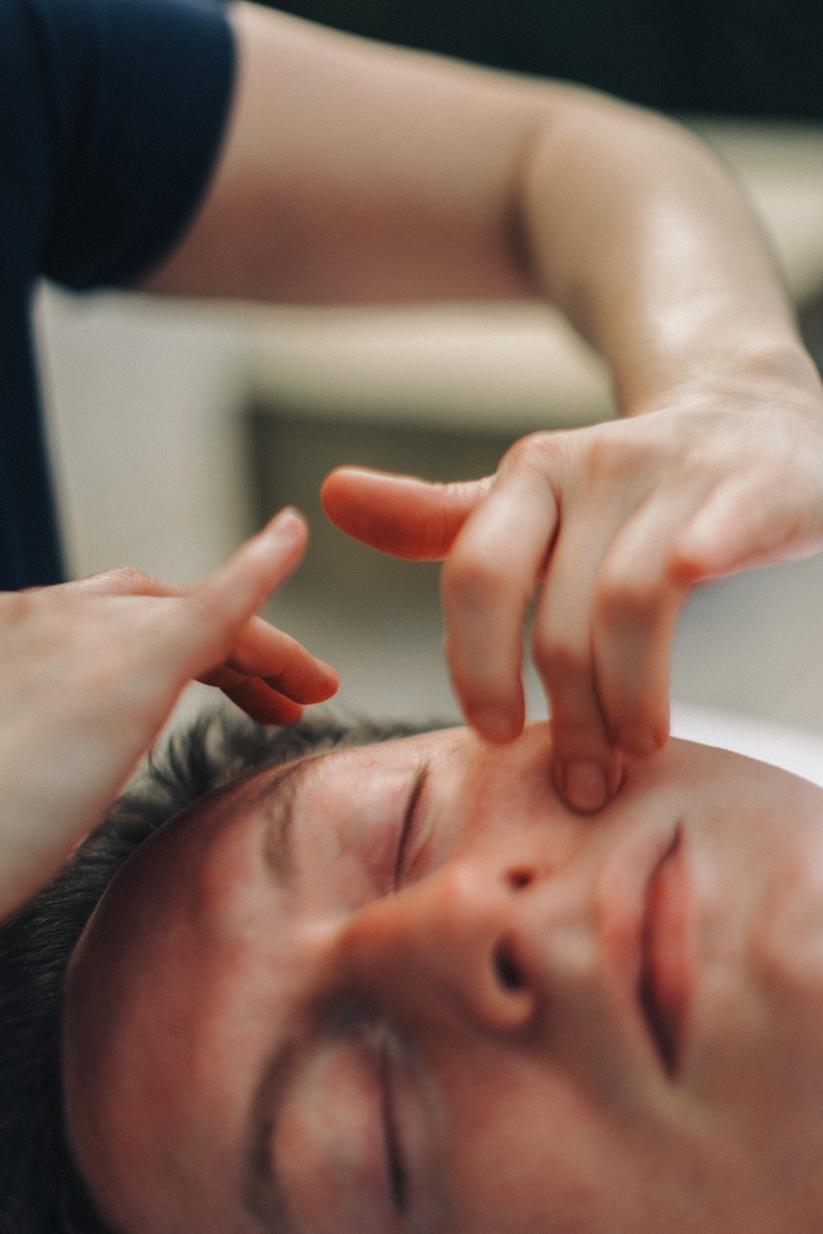 Asia performing Kobido facial massage